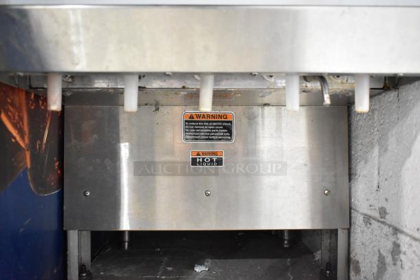 Bunn stainless steel commercial cappuccino machine with warning labels visible, 120/208-240 volts, used condition.