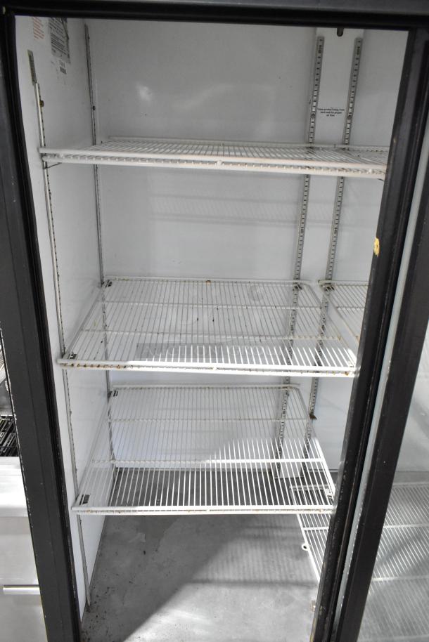 Beverage Air MT45 commercial 2-door cooler with poly-coated racks. Visible wear, 115V, 1 phase. Ideal for merchandising.