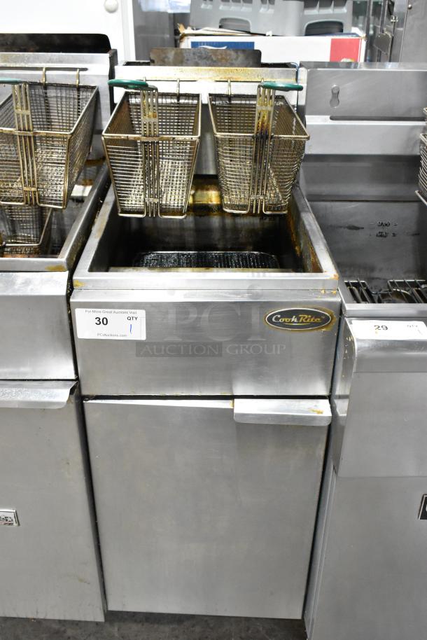 Cookrite stainless steel commercial gas deep fat fryer with dual baskets, showing signs of use, model label visible.