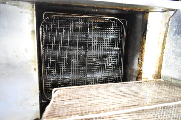 Cookrite stainless steel commercial gas deep fat fryer with visible grate and frying basket. Used condition.