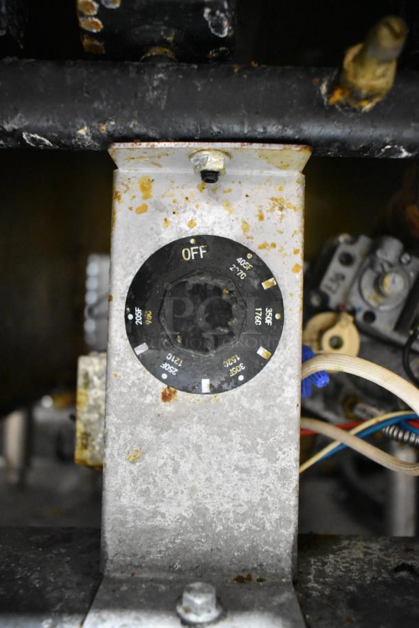 Cookrite stainless steel commercial gas deep fat fryer, shows control dial with temperature settings, some surface wear.