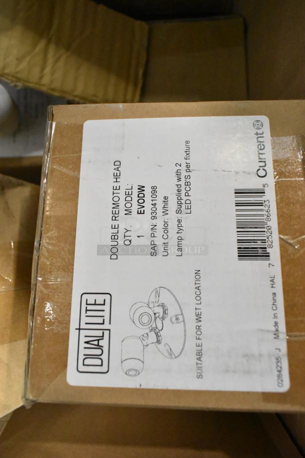 Pallet lot of various light fixtures, including Dual Lite emergency light, model EVODW, double remote head, new in box.