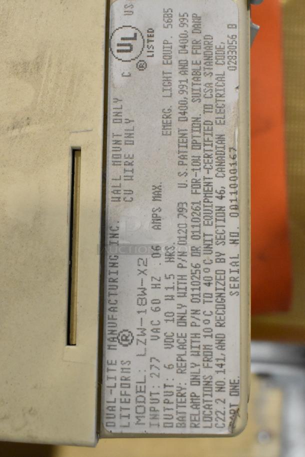 Alt text: Dual-Lite emergency light label with model LZW-18W-X2, 277 VAC input, UL listed, showing detailed specifications.