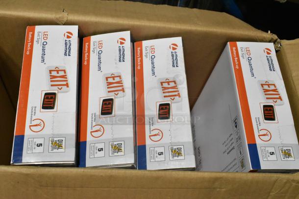 Pallet lot of various light fixtures, including Lithonia Lighting LED Quantum exit signs with battery backup, in original packaging.
