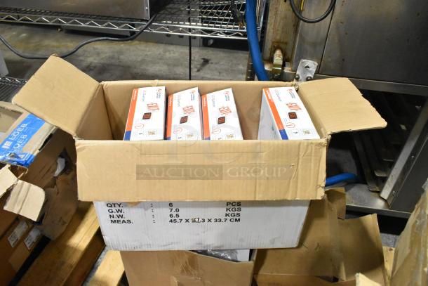 Box of various light fixtures including emergency lights, showing packaging details. Box marked "QTY: 6 PCS, G.W.: 7.0 KGS."