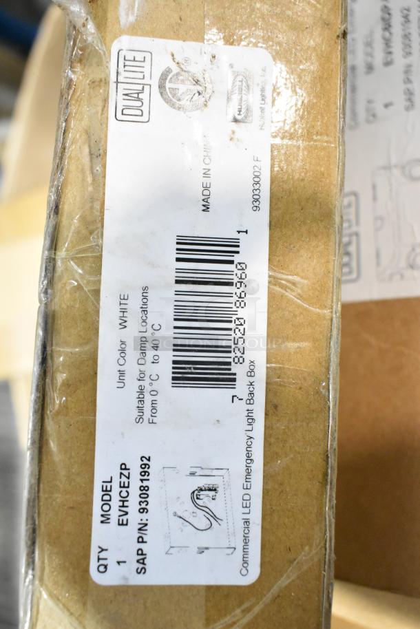 ALL ONE MONEY! Pallet of light fixtures including DUAL LITE emergency light. Model EVHCEZP, new condition, suitable for damp locations.