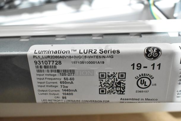 Lumination LUR2 Series Light Fixture label showing model PL1_LUR2D80A0V1840VQCSWHITESIN-MG, 73W, 10400 lumens, UL certified.