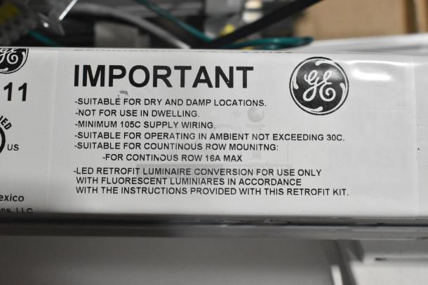 Alt text: GE retrofit label for luminaire conversion. Details suitability for dry, damp locations and installation specifications.