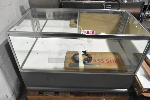 WM19SGMOD Display Case Merchandiser, 120 Volts, 1 Phase. Glass front, metal frame, includes power cord. Good condition, fragile label visible.