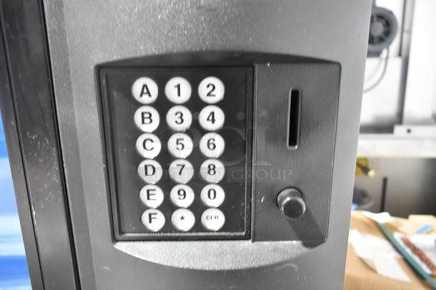 Crane 5800-4 metal vending machine, keypad and coin slot visible, 115 volts, 1 phase, commercial use.