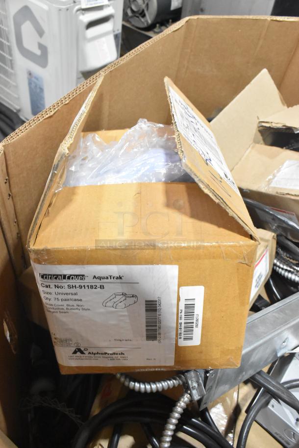 Pallet lot featuring Critical Cover AquaTrak shoe covers, wires, and Wiremold CDBB1420C-40BK CD with outlet box.