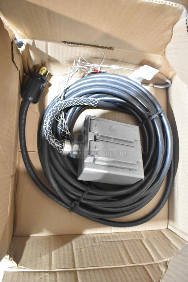 Pallet lot with Wiremold CDBB1420C-40BK outlet box, wires, and shoebox in cardboard box. Includes AquaTank shoe covers.