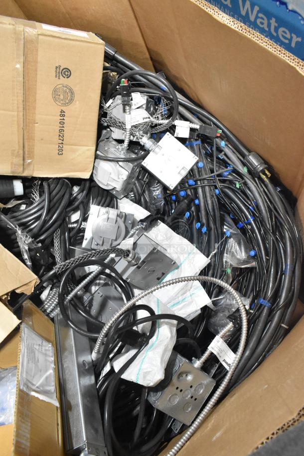 Pallet lot containing Critical Cover AquaTank shoe covers, wires, Wiremold CDBB1420C-40BK CD with outlet box, assorted new items.