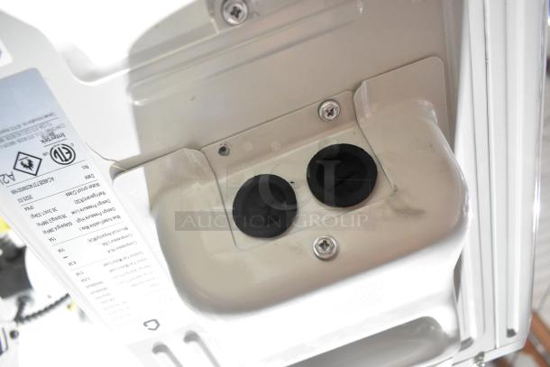 2025 Garvee SAC18-2-S19 outdoor AC unit. Includes label with specs. 18,000 BTU, 208/230V, 1 Phase.