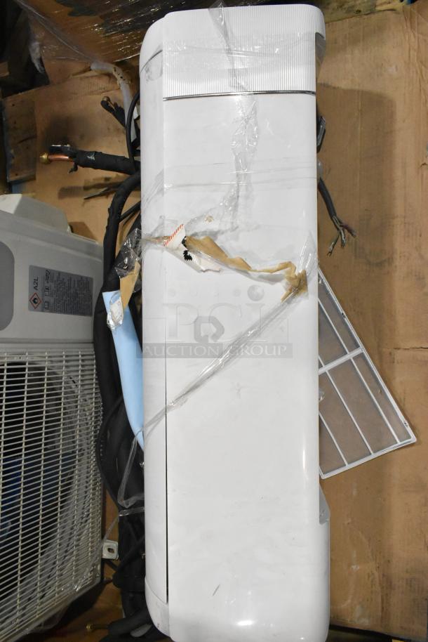 2025 Garvee SAC18-2-S19 air conditioning unit and air curtain, 18,000 BTU, 208/230V, 1 Phase. Visible signs of wear.