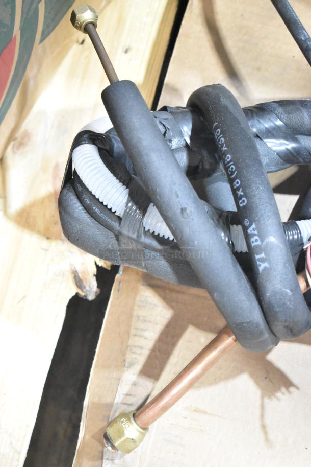 2025 Garvee SAC18-2-S19 air conditioning outdoor unit hose and connections, featuring visible YIBA markings.