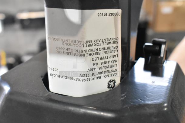 Label on GE outdoor light fixture, 120V, 480V, max amps 0.4, system watts 212W, suitable for wet locations.