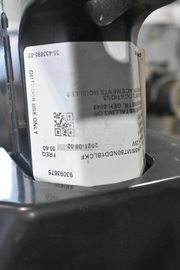 Pallet of various items featuring outdoor light fixtures, label marked for outdoor use, model C5H-6049, dated 2021-08-02.