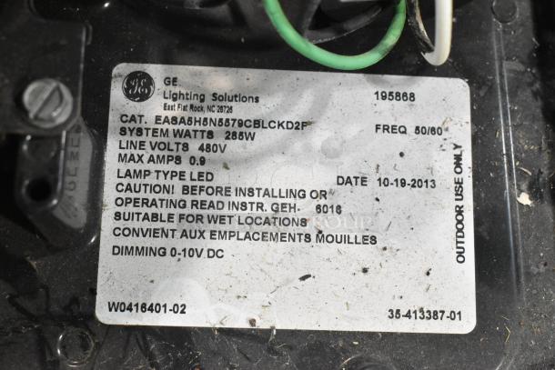 GE Lighting Solutions label on outdoor LED fixture, 285W, 480V. Marked for wet locations. Dated 10-19-2013. Model EASA5H5N65879CBLCKD2F.