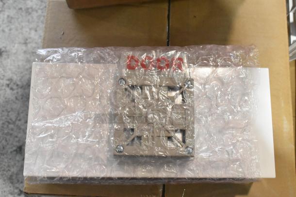 General Electric light fixture in bubble wrap, part of 8-item auction lot. Includes Current Evolve LED Series.