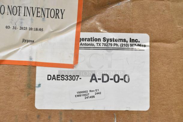 Cardboard box with labels, including "DO NOT INVENTORY" and serial codes. Contains General Electric light fixtures, Current Evolve LED Series.