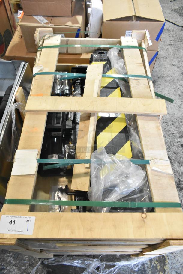 Brand new Challenger Lifts CL RJ7.5 rolling jack in crate for 4-post car lift, secured with straps and protective packaging.