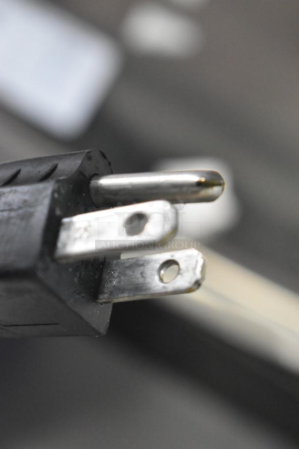 Close-up of a power plug for a 2017 Hobart HTi-LS26 Metal Countertop Scale. Model supports 120/208-240 volts, 1 phase.