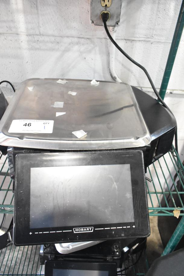 2017 Hobart HTi-7LH26 metal countertop scale with label printer. Power cord cut, untested. Includes touchscreen display.