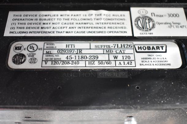 2017 Hobart HTi-7LH26 metal countertop scale with label printer, model and serial numbers visible. Power cord cut.