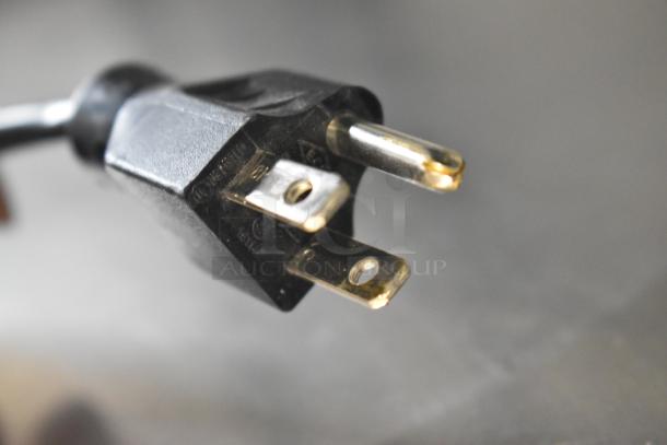 Three-prong plug of the 2019 Hobart HTi-LH3 metal countertop scale with label printer.