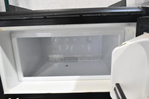 Absocold ARD298CB10R mini cooler with freezer. Black exterior, white interior, 115V, 1 phase. Clean, good condition.