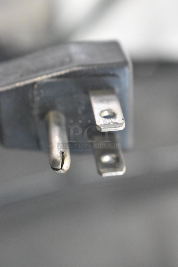 Close-up of a plug for Absocold ARD298CB10R Mini Cooler with Freezer, 115V, 1 Phase.