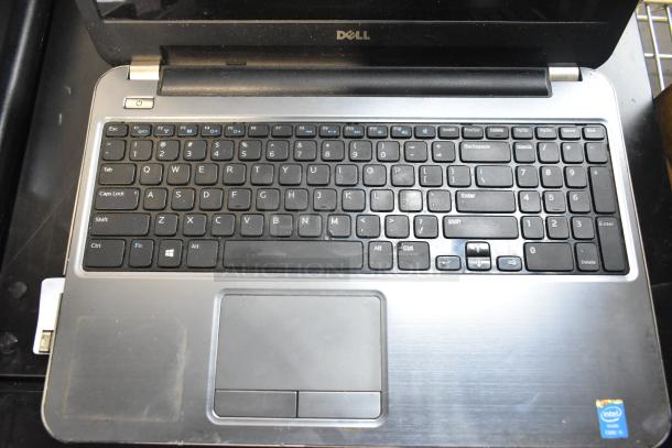 Dell Inspiron 15R-5537 laptop, Intel Core i5, visible wear, includes charger, Windows logo on keyboard.