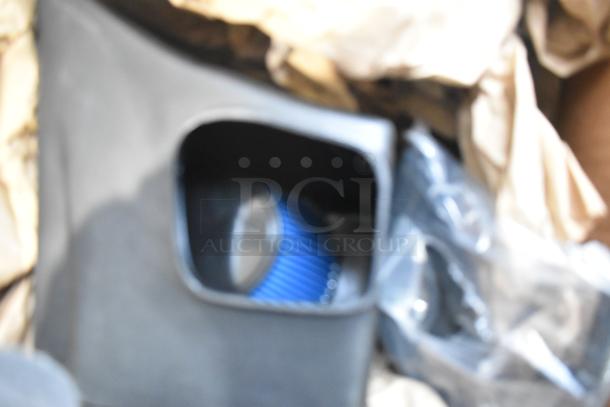 Volant Closed Box Air Intake System, blue filter, black enclosure, visible light wear, enhances engine performance.