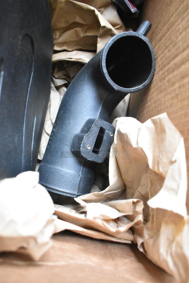 Volant Closed Box Air Intake System in black, appears in excellent condition, nestled in paper packing in a cardboard box.