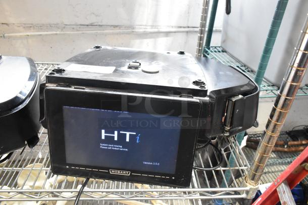 Hobart HTi metal countertop scale with label printer, missing plate, tested and working, 120/208-240V, 1 phase.