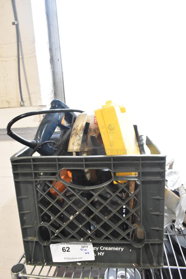 Tier lot including Ryobi saw, various ropes, BerneAparel and Carhartt overalls in a crate; auction tag visible.