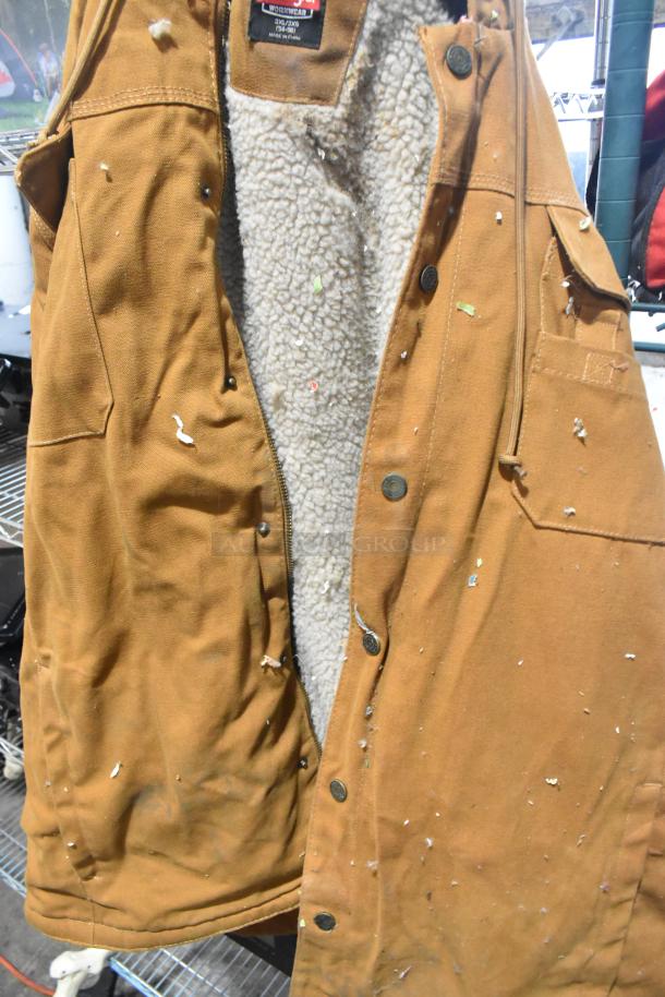 BerneApparel brown overalls with button closure, fleece lining, visible wear and debris, label states size 3XL.