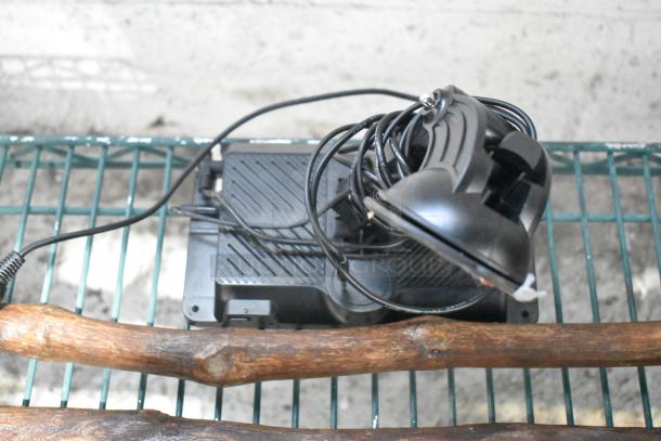 Tier lot with various items including a black speaker, coiled cables, and wooden hitch. Items appear used.