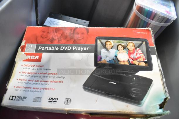 RCA Portable DVD Player with 9" swivel screen in original box, slight box wear, includes accessories.