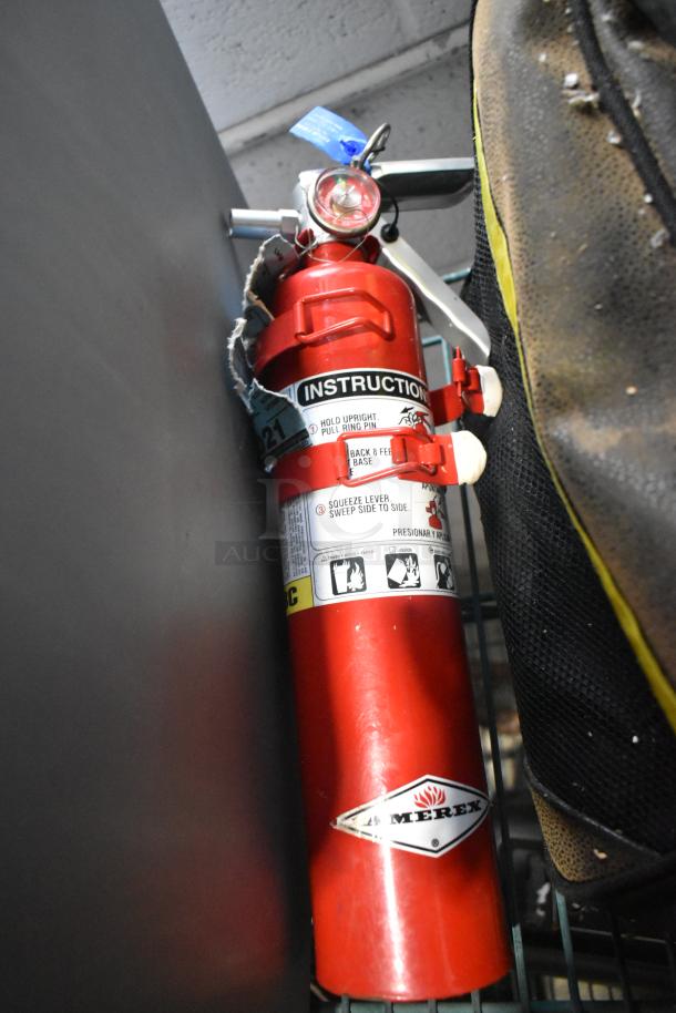 Amerex fire extinguisher, red, with instruction labels visible. Not available for shipping.