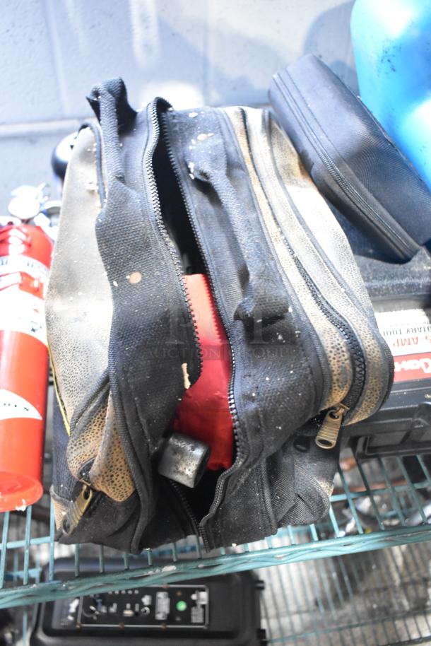 Lot including Amerex fire extinguisher, black tool bag, and portable DVD player. Items show signs of wear.