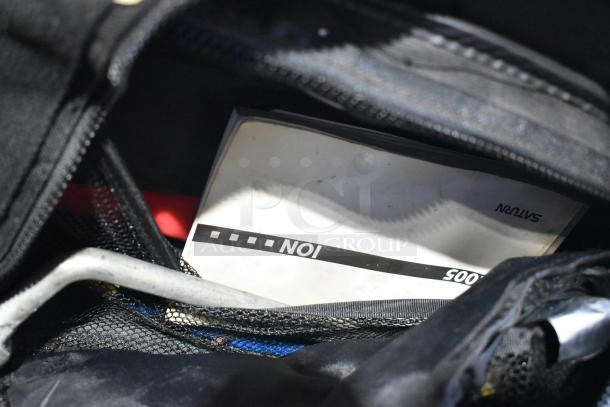 Tier Lot with various items, including a portable DVD player, DVDs, markers, tools, and a visible Saturn label.