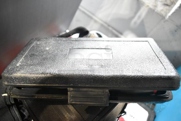 Tier lot with portable DVD player, DVDs, markers, tools. Includes Amerex fire extinguisher (not shipped). Used condition.