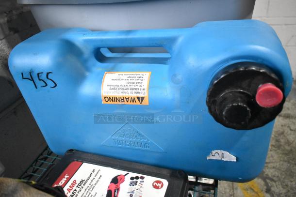 Blue Tote-A-Long fuel container with warning label and black cap, number "455" marked on side. Part of tiered auction lot.