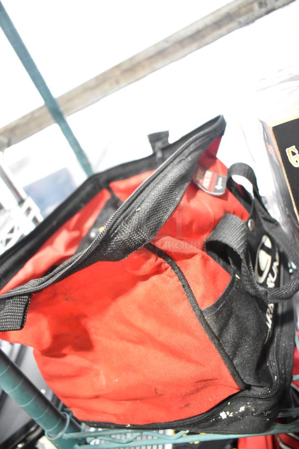 Red and black tool bag, lightly used, containing various items including tools, Permatex Gasket Maker, and HWStar LED headlights.