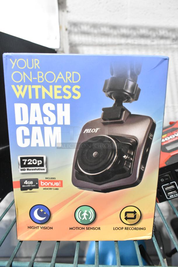 Auction tier lot including tool bag, tools, Permatex gasket maker, toy, first aid kit, HWStar LED headlights, Pilot dash cam.