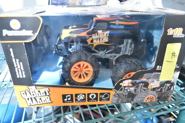Permatex Gasket Maker RC Car, 1:18 scale, new in box, features music, 360 rotate, lights, and spray; for ages 8+.
