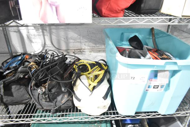 Lot of miscellaneous items including jumper cables, tools, and a rainsuit in good condition. Labels display "Sterilite" and "72".