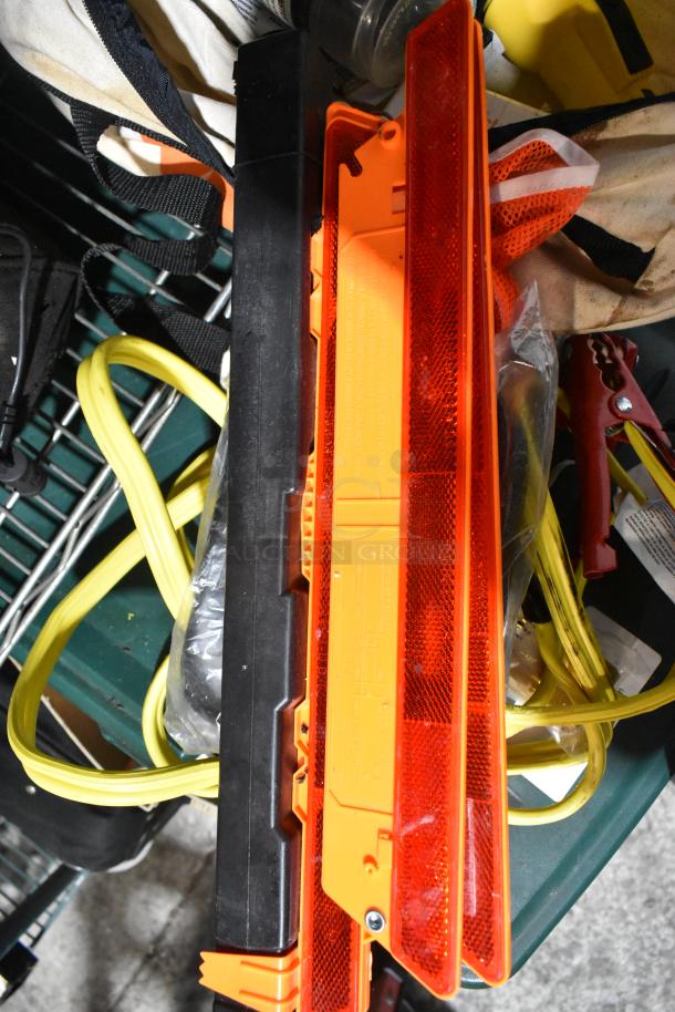 Tier lot including jumper cables, tools, and an orange safety triangle set. Includes a canvas carry bag. Mixed condition.